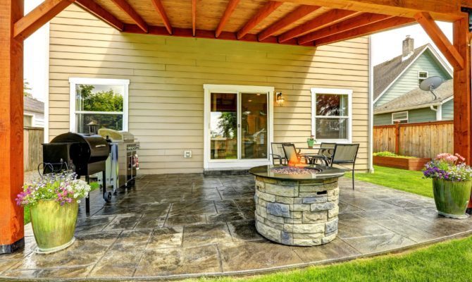 outdoor fire pit under backyard gazebo