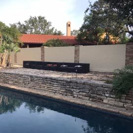 alamo fence wrapping around home backyard pool